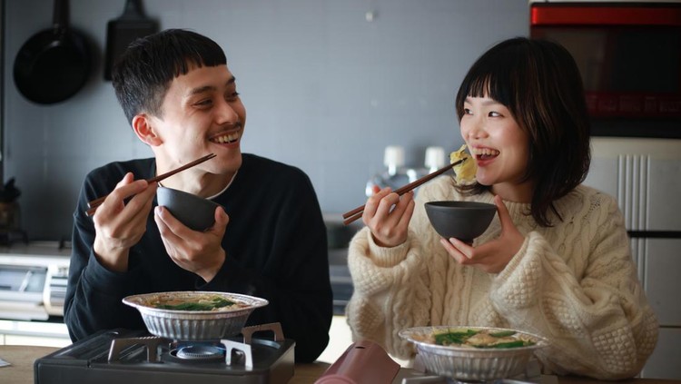 Couple eating a pot