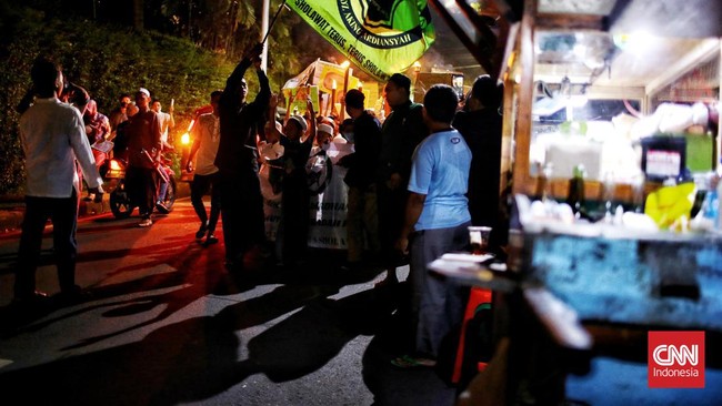 FOTO: Pendar Cahaya Pawai Obor Sambut Ramadan di Jakarta