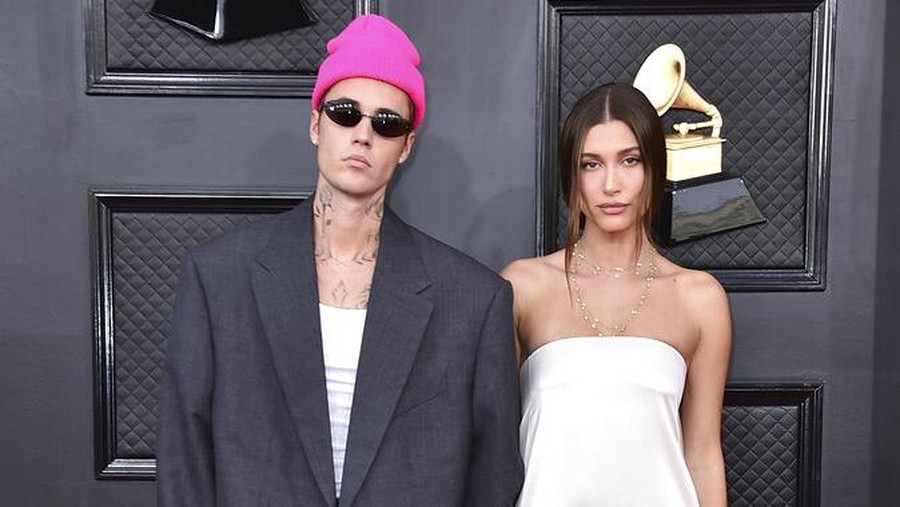 Justin Bieber, left, and Hailey Bieber arrive at the 64th Annual Grammy Awards at the MGM Grand Garden Arena on Sunday, April 3, 2022, in Las Vegas. (Photo by Jordan Strauss/Invision/AP)