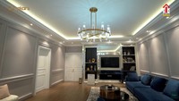 <p>Shireen melengkapi ruang keluarga ini dengan perabot televisi dan sofa kecil berwarna putih di sudut ruangan. (Foto: YouTube The Sungkars)</p>