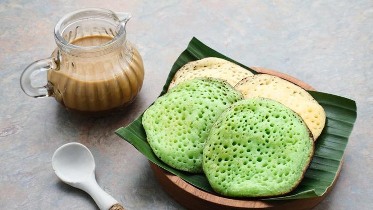Serabi Serabi or Surabi, Indonesian pancake made of flour, rice flour and coconut milk. Served with palm sugar sauce. Sweet and savory.
