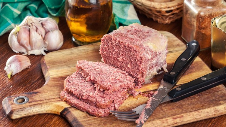 Delicious sliced corned beef on cutting board