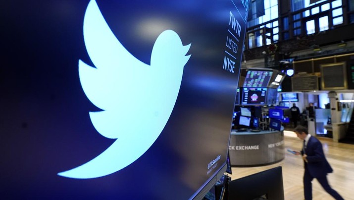FILE - The logo for Twitter appears above a trading post on the floor of the New York Stock Exchange, Monday, Nov. 29, 2021. Elon Musk is taking a 9.2% stake in Twitter. Musk purchased approximately 73.5 million shares, according to a regulatory filing. (AP Photo/Richard Drew, File)