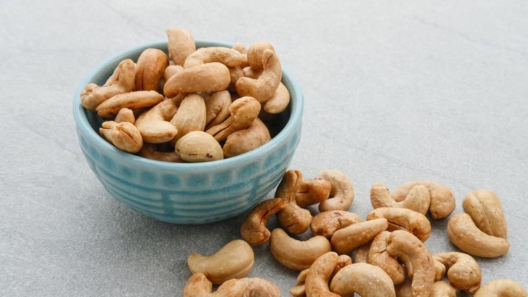 kacang mete Cashew Nut, in Indonesia known as Kacang Mete. Served on grey background.