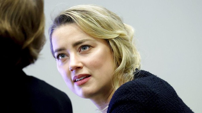 Actress Amber Heard appears in the courtroom during a hearing at the Fairfax County Circuit Court in Fairfax, Va., Tuesday April 19, 2022. Actor Johnny Depp sued his ex-wife Heard for libel in Fairfax County Circuit Court after she wrote an op-ed piece in The Washington Post in 2018 referring to herself as a 