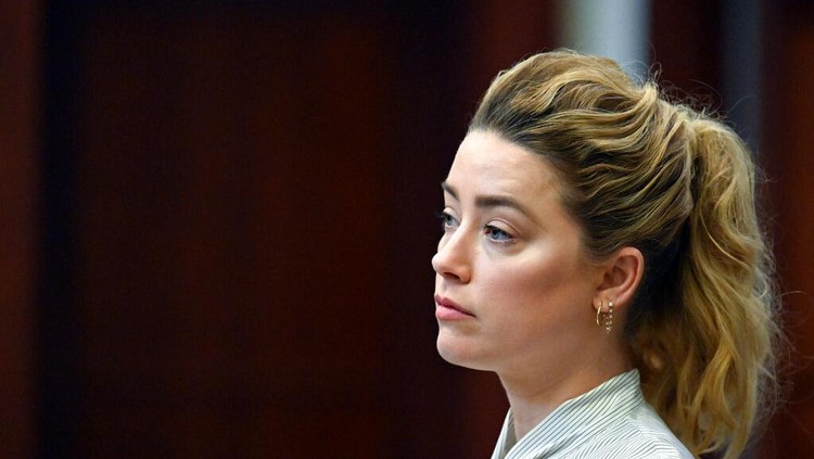 Actress Amber Heard appears in the courtroom during a hearing at the Fairfax County Circuit Court in Fairfax, Va., Tuesday April 19, 2022. Actor Johnny Depp sued his ex-wife Heard for libel in Fairfax County Circuit Court after she wrote an op-ed piece in The Washington Post in 2018 referring to herself as a 