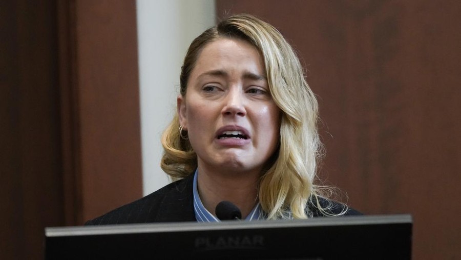 Actor Amber Heard testifies in the courtroom at the Fairfax County Circuit Court in Fairfax, Va., Wednesday May 4, 2022. Actor Johnny Depp sued his ex-wife Heard for libel in Fairfax County Circuit Court after she wrote an op-ed piece in The Washington Post in 2018 referring to herself as a "public figure representing domestic abuse." (Elizabeth Frantz/Pool Photo via AP)