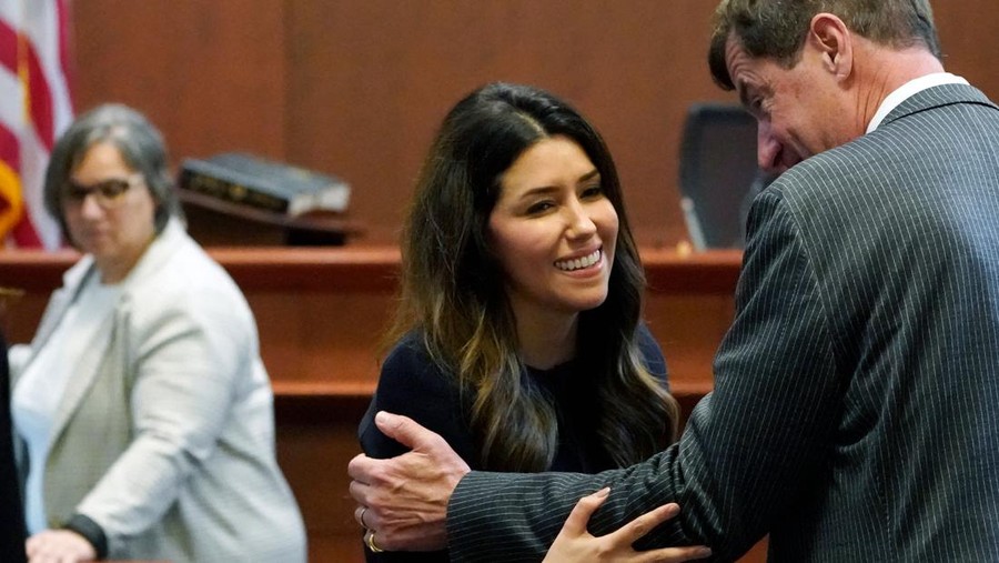Attorney Camille Vasquez talks with attorney Ben Chew, at the end of the daily proceedings at the Fairfax County Circuit Courthouse in Fairfax, Virginia, May 16, 2022. - US actor Johnny Depp sued his ex-wife Amber Heard for libel in Fairfax County Circuit Court after she wrote an op-ed piece in The Washington Post in 2018 referring to herself as a 