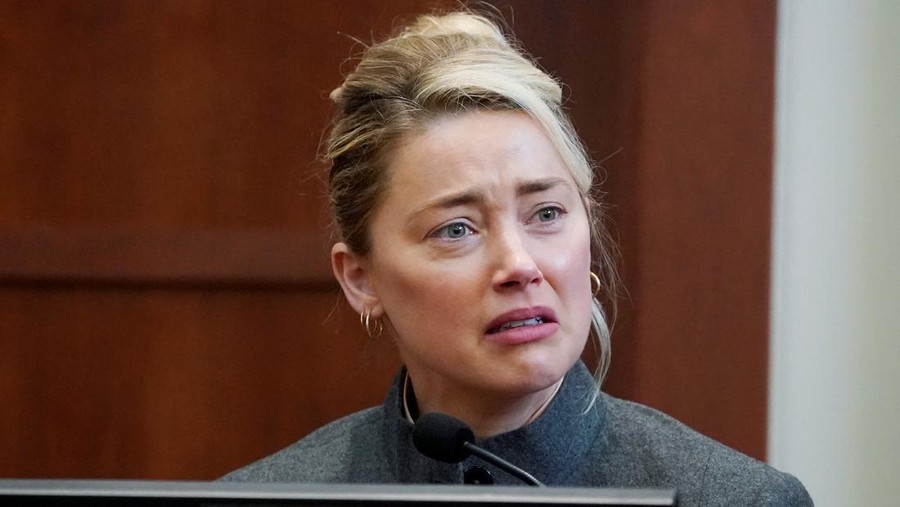 Actor Amber Heard testifies in the courtroom at the Fairfax County Circuit Courthouse in Fairfax, Va., Monday, May 16, 2022.  Steve Helber/Pool via REUTERS