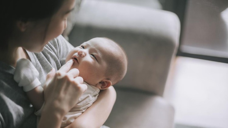 ilustrasi bayi Asian Chinese Mother bonding time with her baby boy toddler at home touching lips talking to him