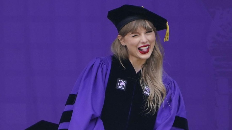 NYU Graduation Taylor Swift speaks during a graduation ceremony for New York University at Yankee Stadium in New York, Wednesday, May 18, 2022. (AP Photo/Seth Wenig)