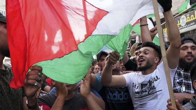 Israel menggodok RUU larangan pengibaran bendera Palestina yang dinilai sebagai ancaman ketika konflik kedua belah pihak terus memanas.