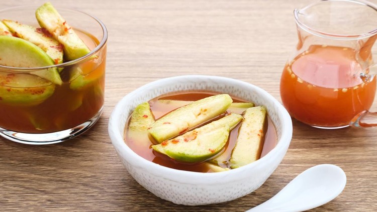 Ilustrasi Manisan Kedondong Asinan Kedondong (pickled fruit), a traditional Indonesian cuisine made from preserved tropical fruits. Spicy, sweet and sour taste.