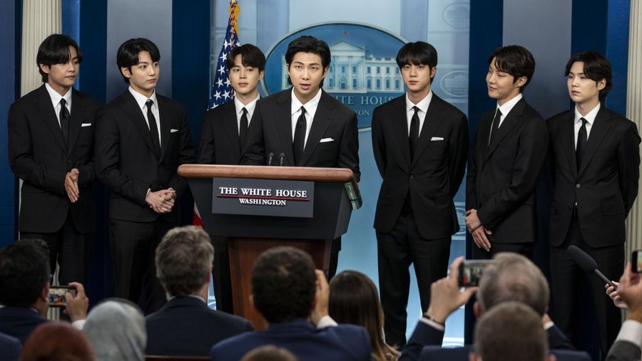 WASHINGTON, DC - MAY 31: Members of the South Korean pop group BTS or Bantam Boys, (L to R) V (Kim Taehyung), JK (Jeon Jungkook), Jimin (Park Ji-min), RM Rap Monster (Kim Namjoon), Jin (Kim Seok-jin), J-Hope (Jung Ho-seok) and Suga (Min Yoongi) speak at the daily press briefing at the White House, on Tuesday, May 31, 2022 in Washington, DC. BTS met with U.S. President Joe Biden to discuss Asian inclusion and representation, and to discuss the recent rise in anti-Asian hate crimes. (Kent Nishimura / Los Angeles Times via Getty Images)