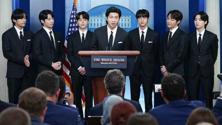 Members of the K-pop supergroup BTS speak as they join White House press secretary Karine Jean-Pierre during the daily briefing at the White House, Tuesday, May 31, 2022, in Washington. (AP Photo/Evan Vucci)