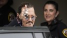 FAIRFAX&comma; VIRGINIA - MAY 27&colon; Actor Johnny Depp &lpar;R&rpar; takes a break during his trial at a Fairfax County Courthouse on May 27&comma; 2022 in Fairfax&comma; Virginia&period; Closing arguments in the Depp v&period; Heard defamation trial&comma; brought by Johnny Depp against his ex-wife Amber Heard&comma; begins today&period; &lpar;Photo by Kevin Dietsch&sol;Getty Images&rpar;