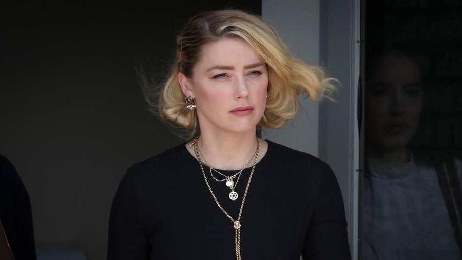 FAIRFAX, VA - JUNE 01: Actress Amber Heard departs the Fairfax County Courthouse on Wednesday, June 1, 2022 in Fairfax, VA. The jury in the Depp vs. Heard case awarded actor Johnny Depp $15 million in his defamation case against Heard. (Kent Nishimura / Los Angeles Times via Getty Images)
