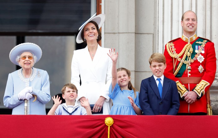 Britain's Catherine, Duchess of Cambridge watches from a window of Buckingham Palace as the troops march past during the Queen's Birthday Parade, the Trooping the Colour, as part of Queen Elizabeth II's platinum jubilee celebrations, in London on June 2, 2022. - Huge crowds converged on central London in bright sunshine on Thursday for the start of four days of public events to mark Queen Elizabeth II's historic Platinum Jubilee, in what could be the last major public event of her long reign. (Photo by Jeff Mitchell / POOL / AFP) (Photo by JEFF MITCHELL/POOL/AFP via Getty Images)