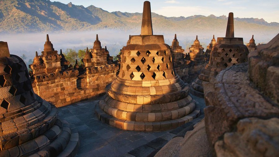 Famous Buddhist Temple Borobudur at Sunrise. Yogyakarta, Island Java - Indonesia