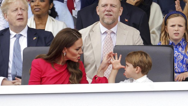 Kate, Duchess of Cambridge, left speaks with Prince Louis, during the Platinum Jubilee Pageant, in London, Sunday June 5, 2022, on the last of four days of celebrations to mark the Platinum Jubilee. The pageant will be a carnival procession up The Mall featuring giant puppets and celebrities that will depict key moments from Queen Elizabeth II’s seven decades on the throne.  (Chris Jackson/Pool Photo via AP)