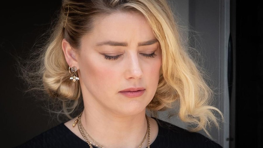FAIRFAX, VA - JUNE 1: (NY & NJ NEWSPAPERS OUT) Amber Heard departs the Fairfax County Courthouse after the verdict announced_on June 1, 2022 in Fairfax, Virginia. The jury in the Johnny Depp vs. Amber Heard case awarded Depp $15 million in damages to his career over an op-ed Heard wrote in the Washington Post in 2018.(Photo by Cliff Owen/Consolidated News Pictures/Getty Images)