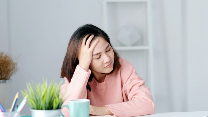 Tired asian woman take a nap at home office, Overworked asia female take a break from stress work, Exhausted office girl asleep at her desk, Depressed people from work at home concept