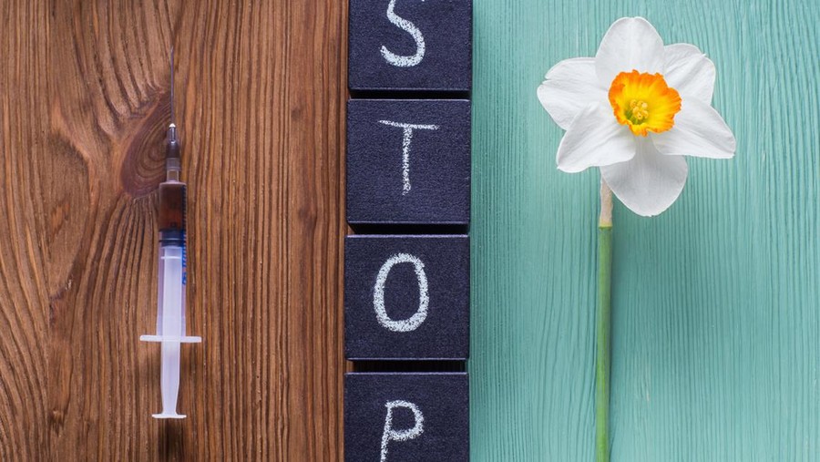 The concept of stop drug addiction. Choosing between drugs and a healthy lifestyle.