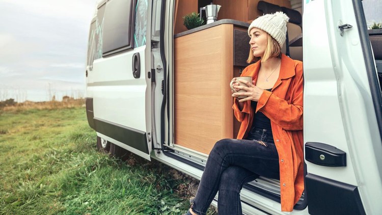 Ilustrasi Single Mom Woman drinking coffee sitting at the door of a camper van