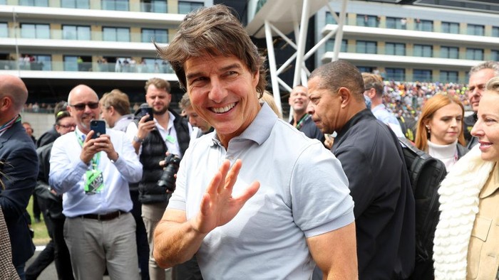 NORTHAMPTON, ENGLAND - JULY 03: Tom Cruise walks in the Paddock prior to the F1 Grand Prix of Great Britain at Silverstone on July 03, 2022 in Northampton, England. (Photo by Clive Mason/Getty Images)