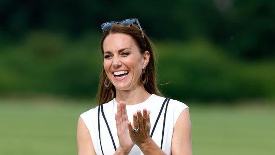 Kate Middleton WINDSOR, ENGLAND - JULY 06: Prince William, Duke of Cambridge and Catherine, Duchess of Cambridge cross the pitch after the Royal Charity Polo Cup 2022 at Guards Polo Club during the Outsourcing Inc. Royal Polo Cup at Guards Polo Club, Flemish Farm on July 06, 2022 in Windsor, England. (Photo by Chris Jackson/Getty Images for TLA Worldwide)