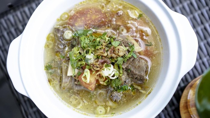 Gulai Kambing or soup Iga. Traditional Javanese mutton curry soup, sop iga sapi, rib beef soup, Indonesian food