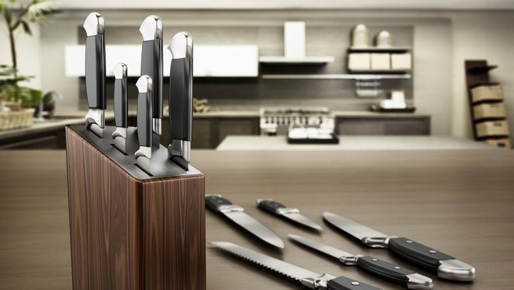 Set of kitchen knives standing on the table.