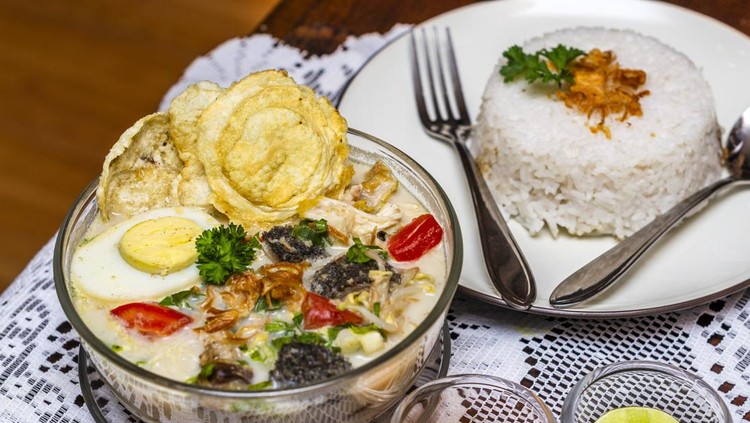 Indonesian traditional food soto Betawi babat served with rice on the table