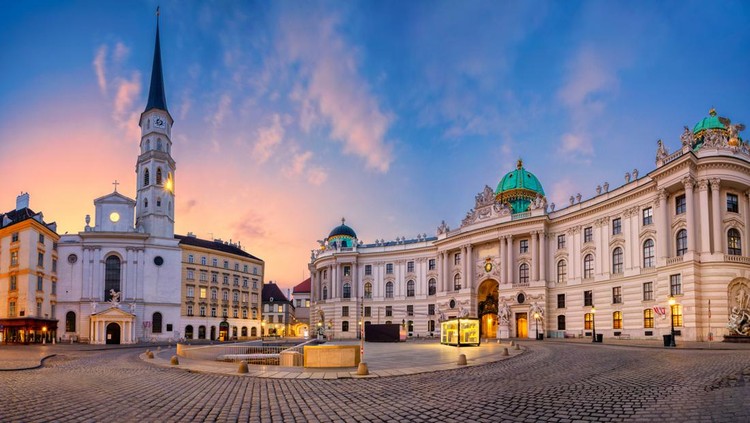 Cityscape image of Vienna, Austria with St. Michael's Square during sunrise.