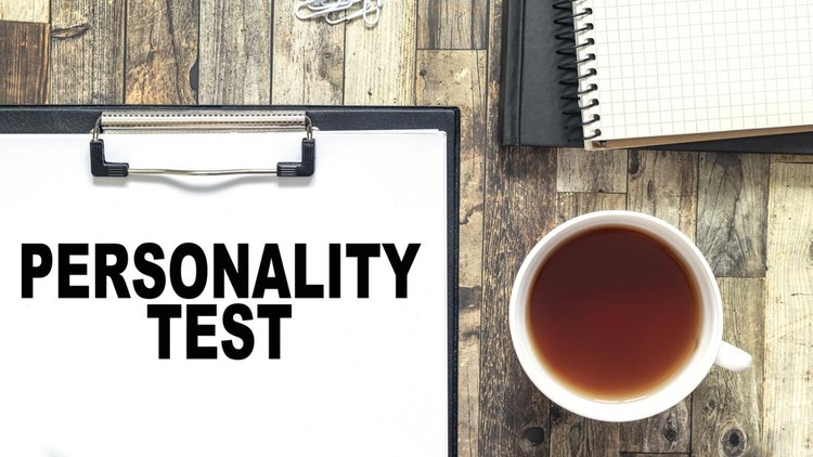 Clipboard with personality test on an office desk. Assessments and business concept.