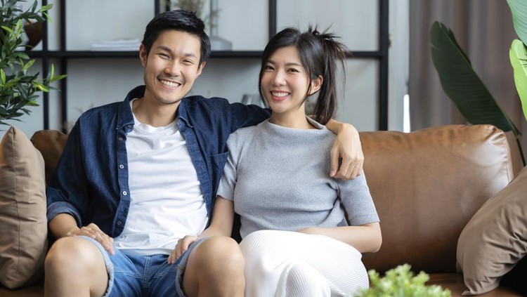 home isolation concept happiness asian love couple familygood conversation on sofa couch in living room ,marry couple laugh smile together on sofa