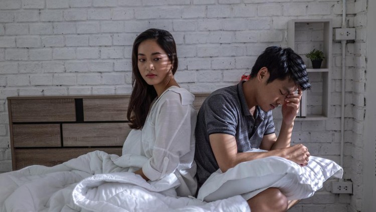Lovers, they have problems with quarrel. They are in bed. they don't talk.Bored of life after marriage