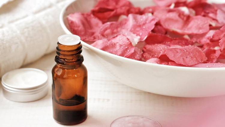 Aromatic body care at-home spa. Natural flower blur effect, pastel toned.