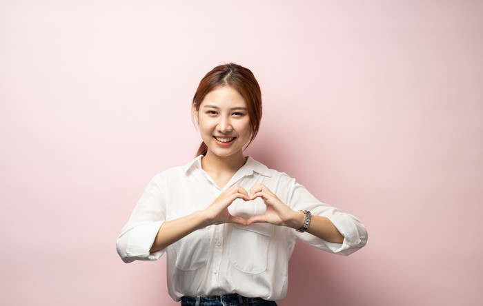 Love all you need. Charming romantic charismatic redhead passionate girl blue eyes show heart gesture confessing sympathy look friendly camera smiling, girlfriend express true feelings