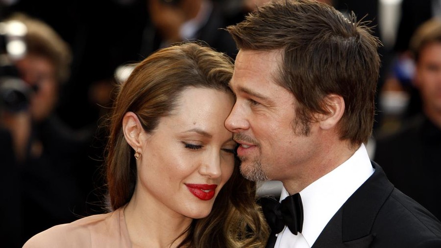 LONDON, UNITED KINGDOM - MAY 08: Brad Pitt and Angelina Jolie attend a private reception as costumes and props from Disney's 