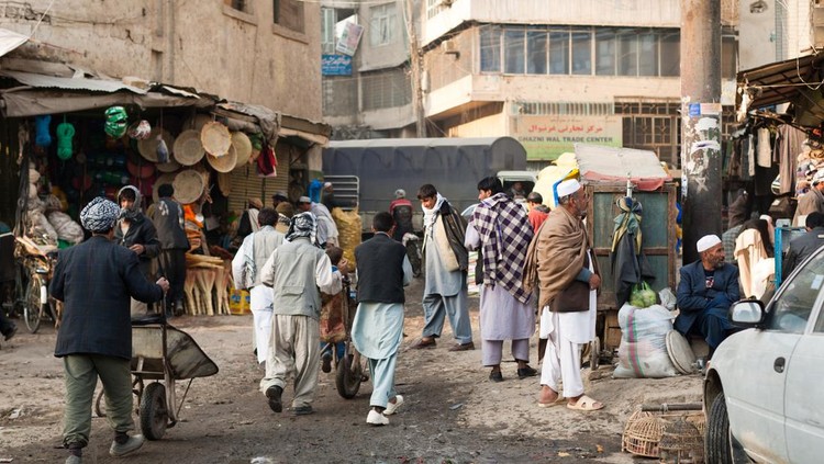 Kabul, Afghanistan- December, 13 2008: People at a back alley street corner in Kabul