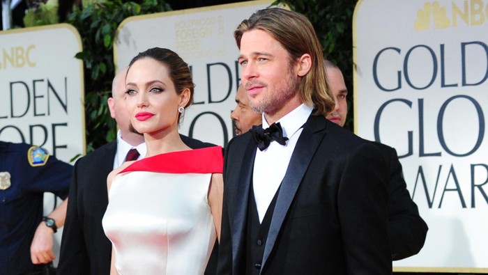 Actors Angelina Jolie and Brad Pitt arrive on the red carpet for the 69th annual Golden Globe Awards at the Beverly Hilton Hotel in Beverly Hills, California, January 15, 2012. AFP PHOTO / Frederic J. BROWN (Photo credit should read FREDERIC J. BROWN/AFP via Getty Images) Actors Angelina Jolie and Brad Pitt arrive on the red carpet for the 69th annual Golden Globe Awards at the Beverly Hilton Hotel in Beverly Hills, California, January 15, 2012. AFP PHOTO / Frederic J. BROWN (Photo credit should read FREDERIC J. BROWN/AFP via Getty Images)