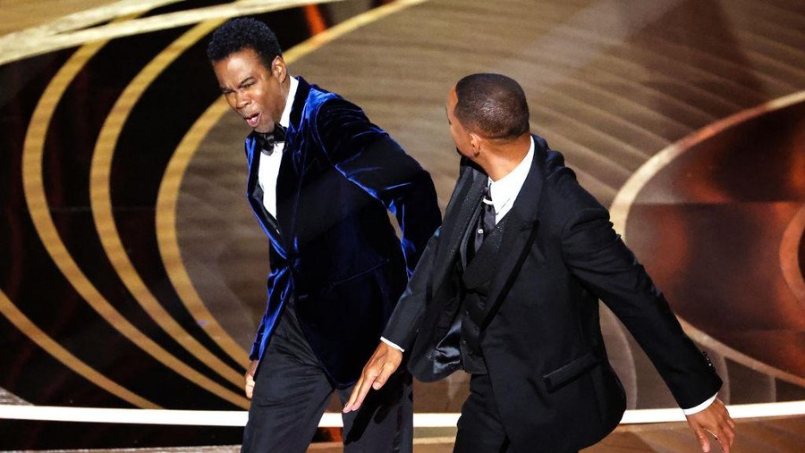 HOLLYWOOD, CA - March 27, 2022.    Will Smith slaps Chris Rock onstage during the show  at the 94th Academy Awards at the Dolby Theatre at Ovation Hollywood on Sunday, March 27, 2022.  (Myung Chun / Los Angeles Times via Getty Images)