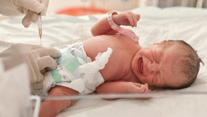 Doctor examines a newborn baby - Turkish ethnicity