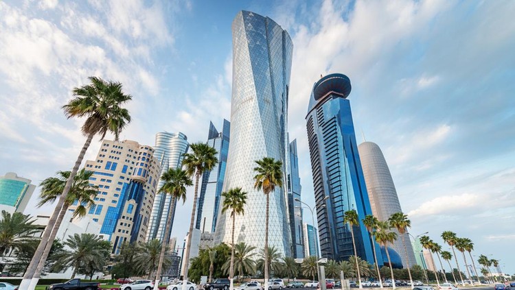 Famous Corniche, the waterfront street along Doha Bay, with its futuristic skyscrapers.