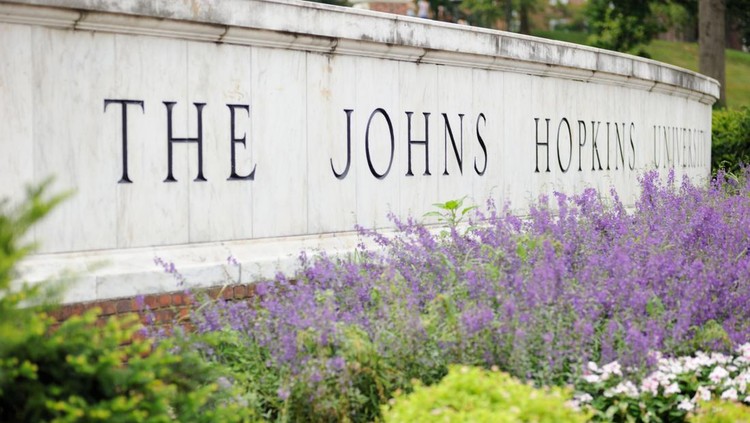 Baltimore, Maryland, USA - July 25, 2016: Close up of sign for The Johns Hopkins University in Baltimore, Maryland.  Sign located on North Charles Street along the east gate to campus.