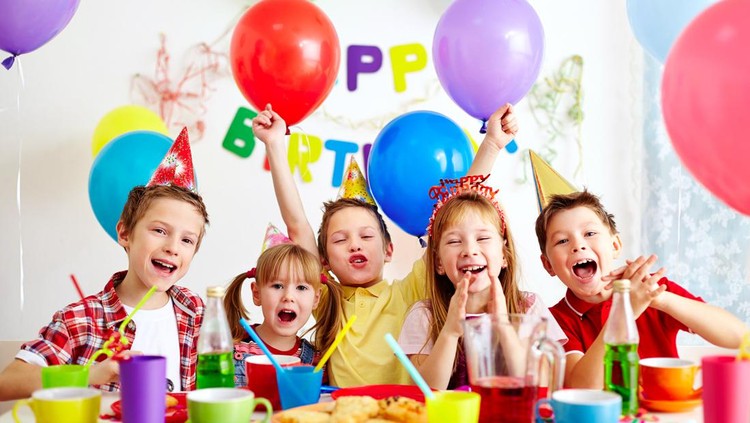 Group of adorable kids having fun at birthday party