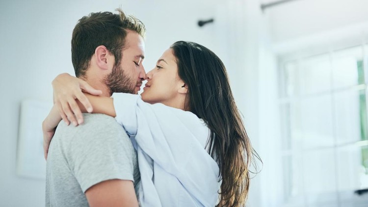 Shot of a young couple sharing an intimate moment in their bedroom