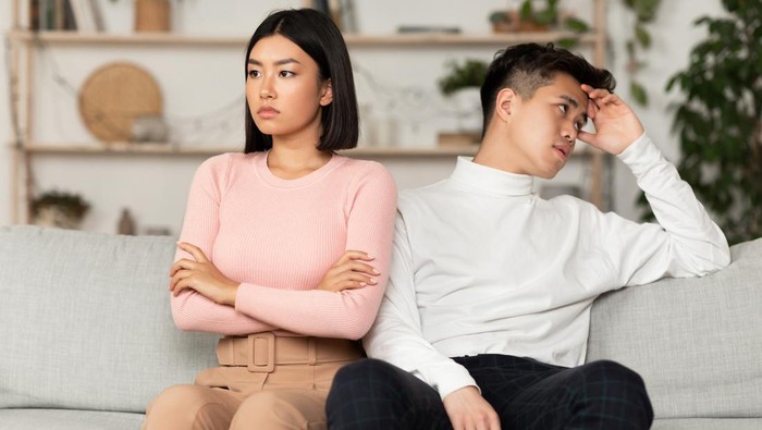 Asian Couple After Quarrel Sitting Offended Not Talking To Each Other Having Relationship Problems At Home. Spouses After Family Conflict, Breakup, Relationship Crisis Concept