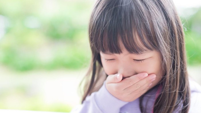 cute little girl get cold and feel vomit, asian